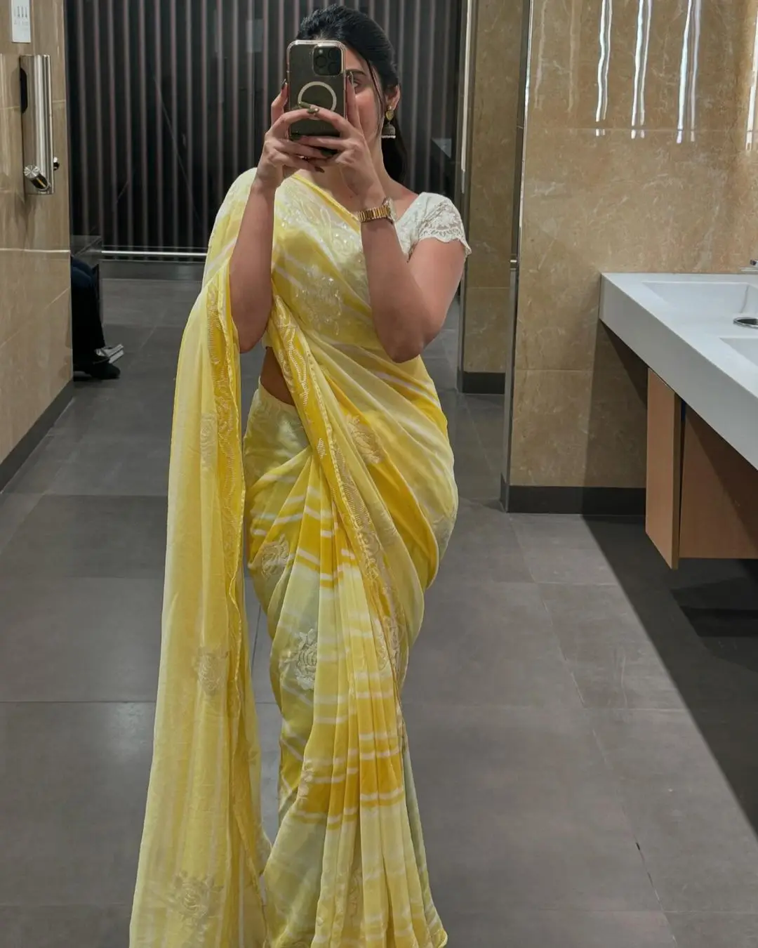 Kushita Kallapu In Traditional Yellow Saree White Blouse